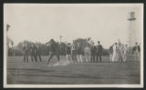 Crowd of people gathered a golfer hitting a driver on a golf course