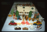 Cookies decorated to look like an outdoor winter scene with a house, by Doris Kirchner, Minneapolis, Minnesota