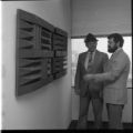 People looking at artwork inside the Natural Resources Research Institute