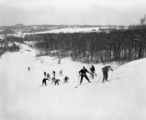 Several people skiing uphill on Rock Hill in winter