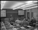 An instructor lecturing in a classroom in the Social Science Building on the UMD campus
