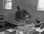 Student pouring a cup of coffee in UMD cafeteria