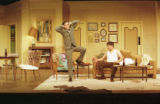 Two actors performing on stage in the 2001 UMD production of "Odd Couple"