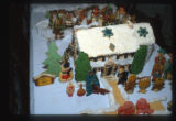 Cookies decorated to look like an outdoor winter scene with a house, by Doris Kirchner, Minneapolis, Minnesota