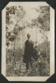 Ernie McLeod standing in a patch of forest surrounding Wolf Lake
