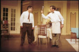 Two actors performing on stage in the 2001 UMD production of "Odd Couple"