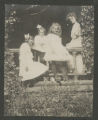Judith Hartley standing with three other children on the front porch of the Hartley house at 1305 East Superior Street