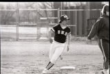 Action shot of UMD 1985 women's softball player running to base