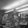 A student checking out at the school store at UMD