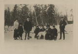 Members of the Tettegouche Club gathered together on a frozen lake