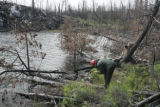 Nick Fisichelli on shoreline of Sea Gull Lake, a year after July, 2006, Cavity Lake Fire.