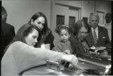 A line of people at a buffet table