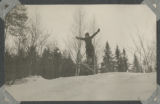 Child skiing down a hill in Woodland