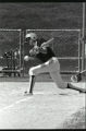 Action shot of UMD 1987 women's softball player hitting ball