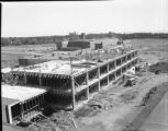Workers on the roof during the construction of the Social Science Building on the UMD campus