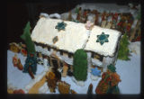 Cookies decorated to look like an outdoor winter scene with a house, by Doris Kirchner, Minneapolis, Minnesota