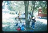 Campers outside by a tree at Camp Butwin, Eagan, Minnesota