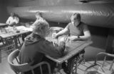 Two students playing chess in the game room at UMD