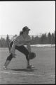 Action shot of UMD 1989 women's softball player getting ready to catch ball