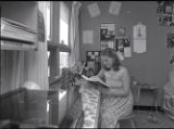 Student reading in their Lake Superior Hall dorm