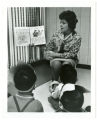 Rhoda Redleaf reads Purim story aloud to a group of young children at the St. Paul Jewish Community Center nursery school