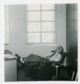 Robert J. Karon asleep at a desk in the First American National Bank building