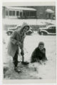 Suzon and Janet Karon shoveling snow