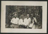Carrie Eliza and Cavour Hartley standing with James Verner Claypool and Carolyn Warmington Munger in front of a patch of woods at the maple sugar camp in Trout Lake