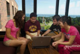 Four people studying inside Lawrence A Ianni Hall