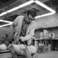 Student in wood carving art class