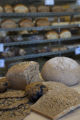 Milling wheat at a small bakery in Maplewood,Minnesota, where breads, muffins, rolls and cookies are baked using Whole grains.