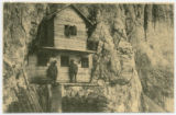 Photo of Alpine soldiers in shelter built into the cliffs of a mountain/Text also in French and English