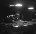 A student playing pool in the games room in Kirby Student Center