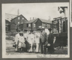 Members of the Hartley family standing together behind a railroad car