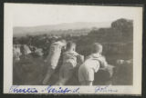 Chester Adgate II, G.G.H., and John Congdon looking over a stone wall at Congdon Castle
