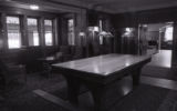 Glensheen's billiards room with billiards table cover
