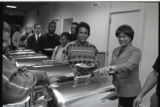 A line of people at a buffet table