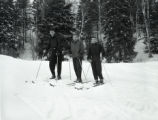 Three UMD 1959 ski team members posed together in their skis