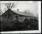 Barn showing piles of refuse