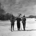 Three people with skis and poles on Rock Hill