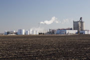 Ethanol plant at Lamberton, Minnesota with corn residue plowed under in field.