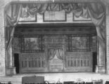 Photograph of a theatre installation depicting an interior scene.