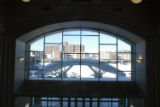 Arched window in the entryway viewed from the second floor inside Kirby Student Center during revovation