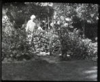 Mrs. Crosby in her garden with Dahlias