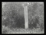 John Nordquist standing beside the Station O. record post at Itasca Park
