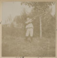 Cavour Hartley holding a crossbow