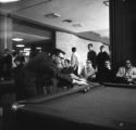A student playing pool in Kirby Student Center