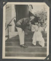 Douglas Hammond Lewis and Judith Hartley on the front steps to the Hartley house at 1305 East Superior Street
