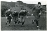 Football Team Members Walter Hass, Francis (Pug) Lund, Myron Ubl, Jack Manders (left to right)
