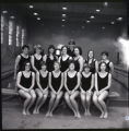 UMD 1969 women's swim team in front of the pool